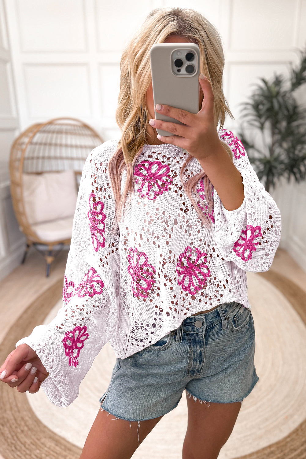 White drop shoulder sweater with contrast floral print eyelets