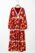 Vestido largo naranja con estampado floral y borde en encaje de cabaña con V -collar