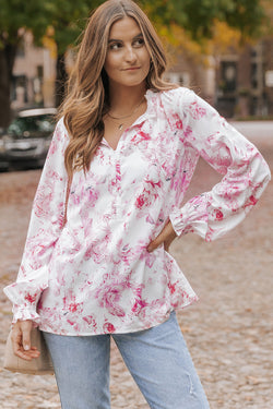 Multicolored blouse with vibrating floral print and ruffle border