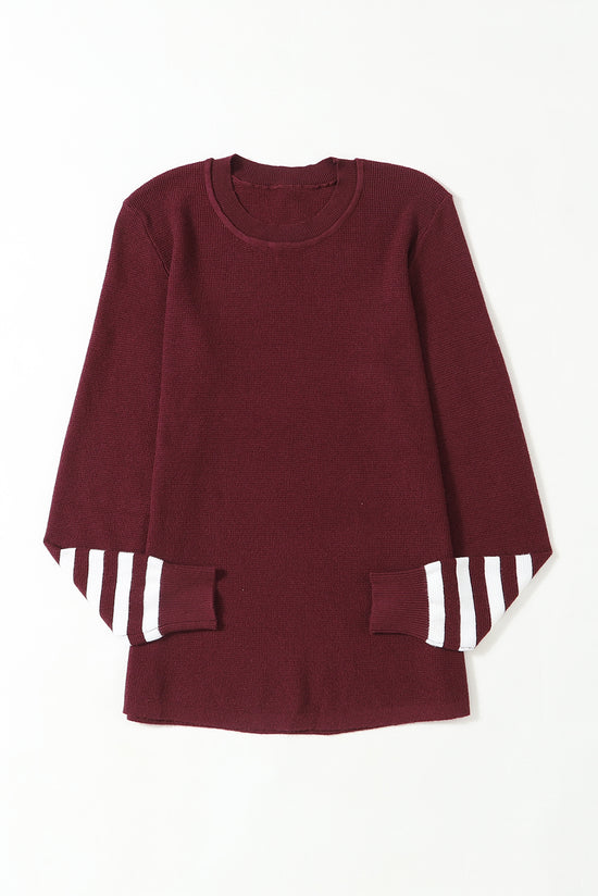 United knitting sweater with red striped sleeves