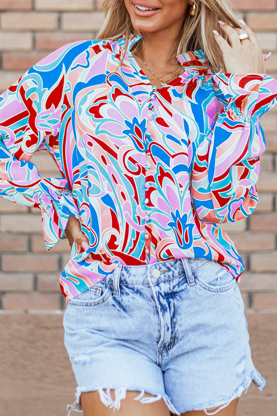 Pink blouse with abstract print and ruffled collar and ruffle sleeves