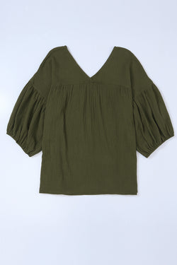 Textured green babydoll blouse in V -collar and bracelet sleeves