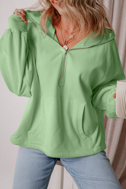 Loose fitting half zip hoodie with kangaroo pockets lined with smoke green fleece