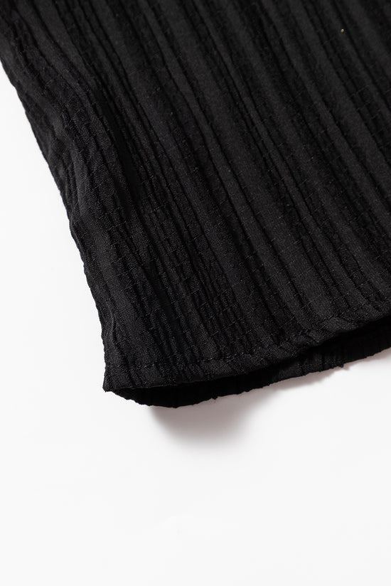 Typled black high with fluffed sleeves and v -neck