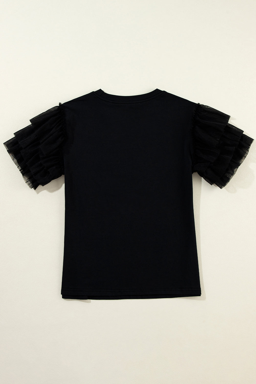 Blouse noire à manches volantées en tulle-A WOMAN WE LOVE