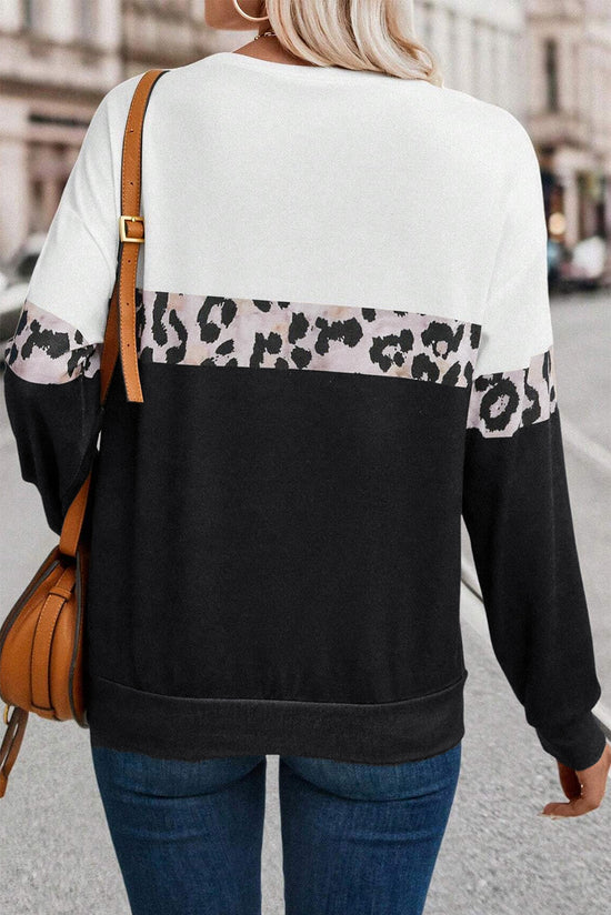 Black leopard top with long sleeves and a color block crew neck