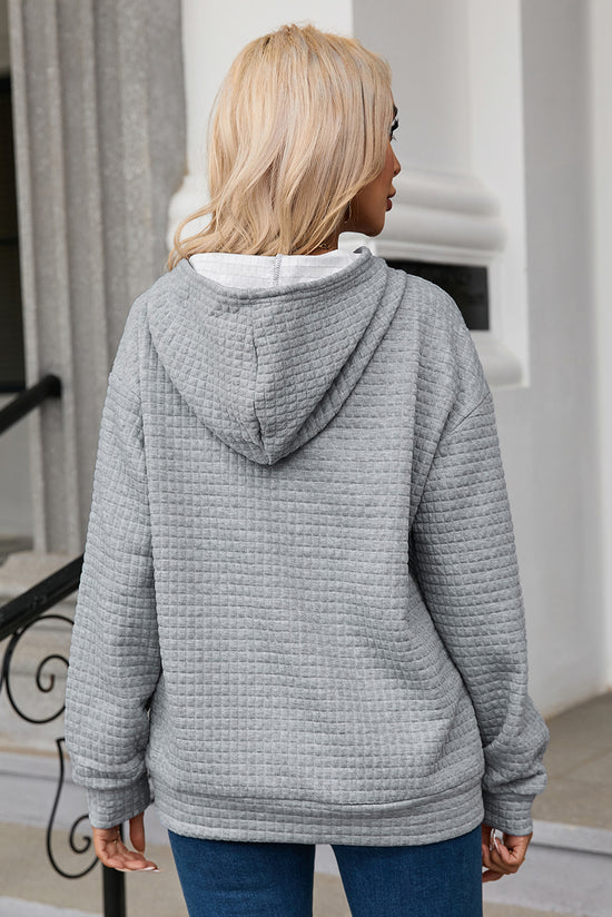 Grey quilted hoodie with kangaroo pocket and drawstring