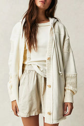 Functional coat with contrasting beige knitted patchwork hood