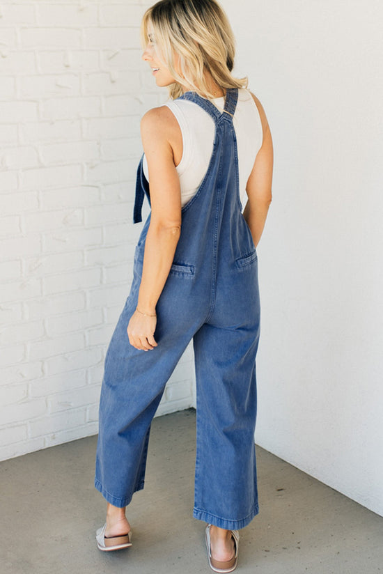 Blue Denim overalls of Prussia with knotted straps and pocket pocket, wide leg