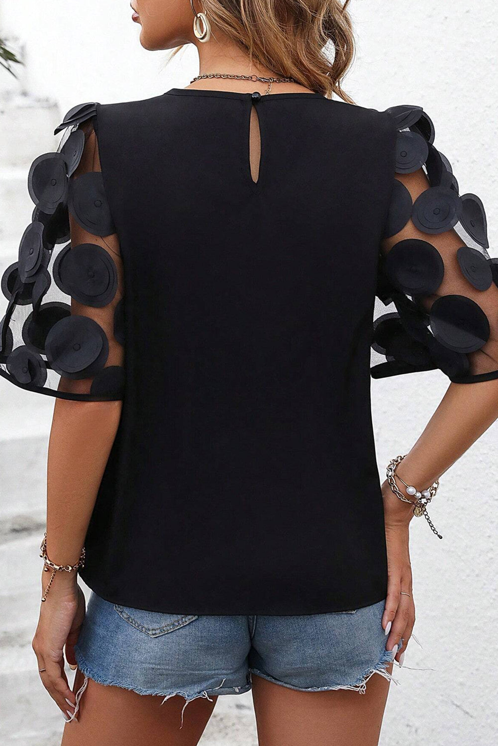 Blouse noire à manches mi-longues en maille avec appliques contrastées