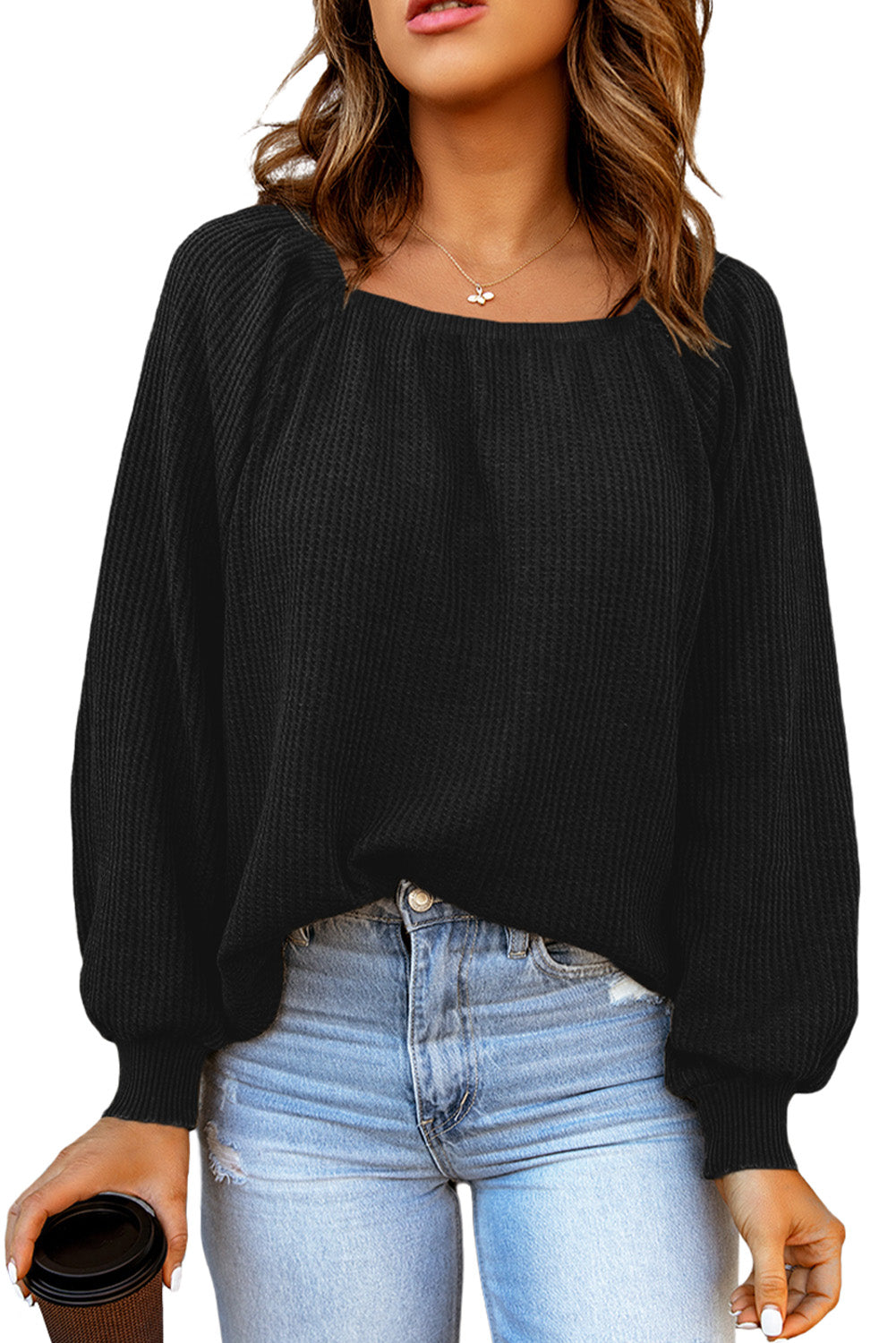 Black waffle knit top with puff sleeves and scoop neck
