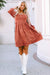 Brown suede dress with square neck and puffed sleeves