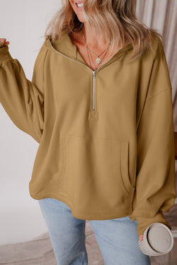 Brown loose hoodie with kangaroo pockets and half-zip lined with fleece