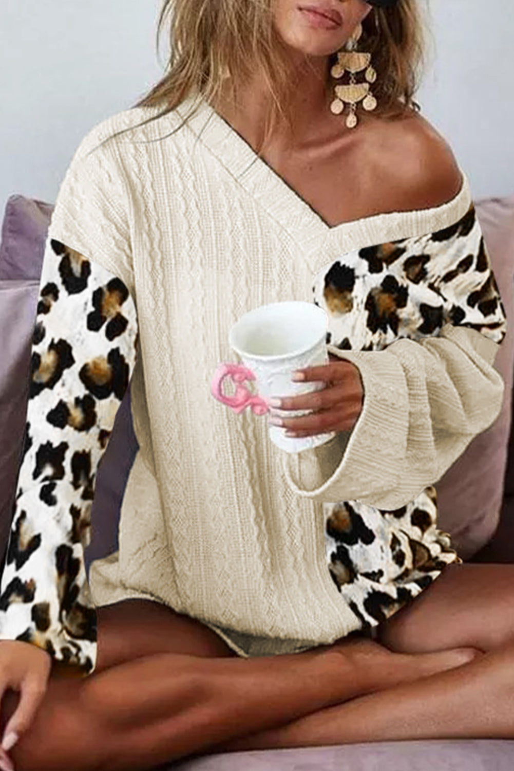 Asymmetrical leopard patchwork sweater with wide sleeves and beige V-neck