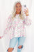 Babydoll pink blouse with floral print and frozen balloon sleeves with lock hole on the back