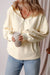 Beige loose hoodie with kangaroo pockets and semi-ferms flash lined with fleece