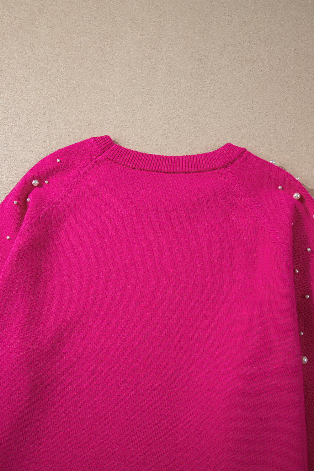 Plus size sweater with raglan sleeves and strawberry pink pearl decoration