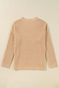 Ample knitted apricot knit sweater with drooping shoulders and side slits