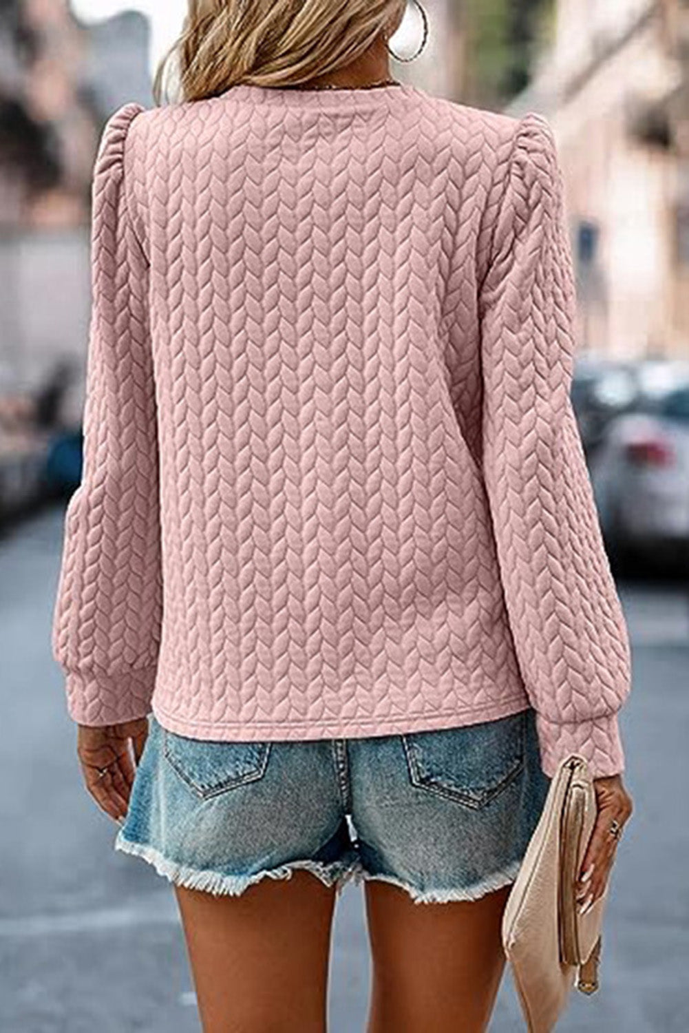 Sweat-shirt rose clair à manches bouffantes texturées et torsadées