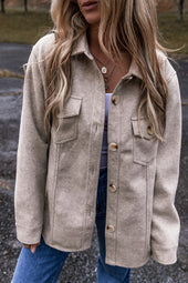 Light gray buttoned jacket with turndown collar and flap pockets