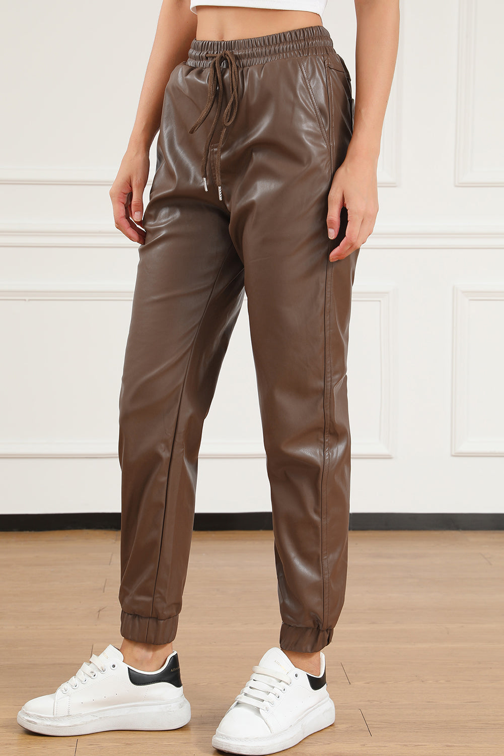 Brown leather jogging pants with waist tie