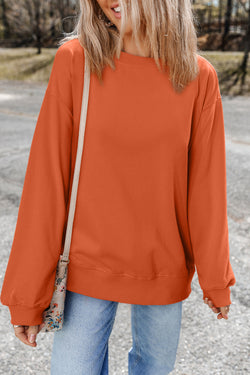 Plain orange crew neck sweatshirt with dropped shoulders