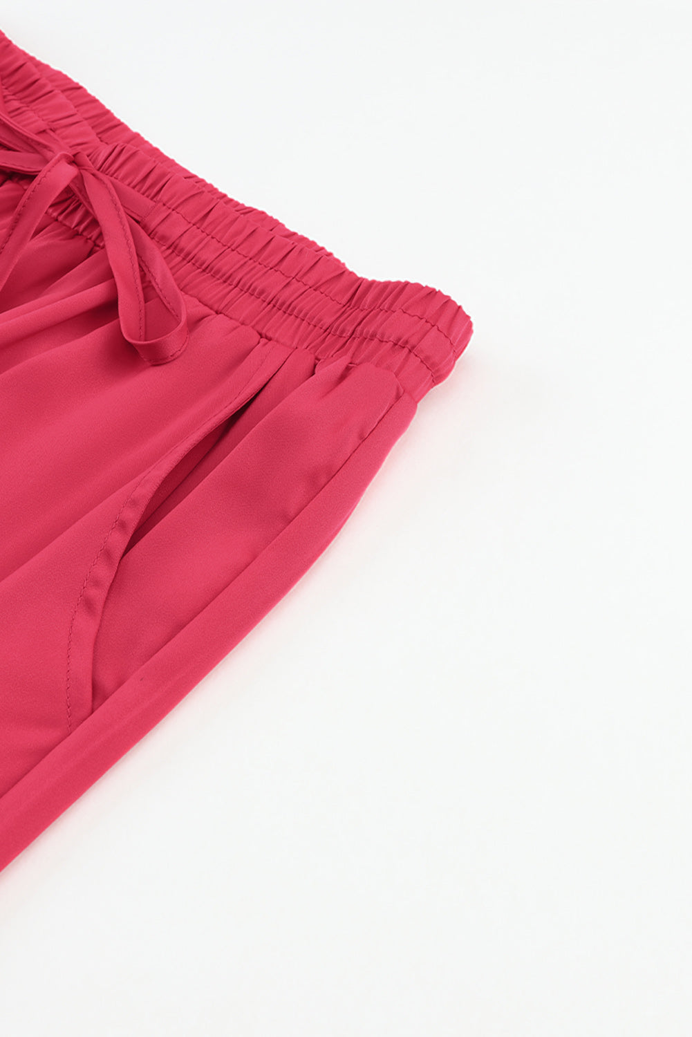 Pantalones de cintura elástica con cordón y bolsillos de satén rosa