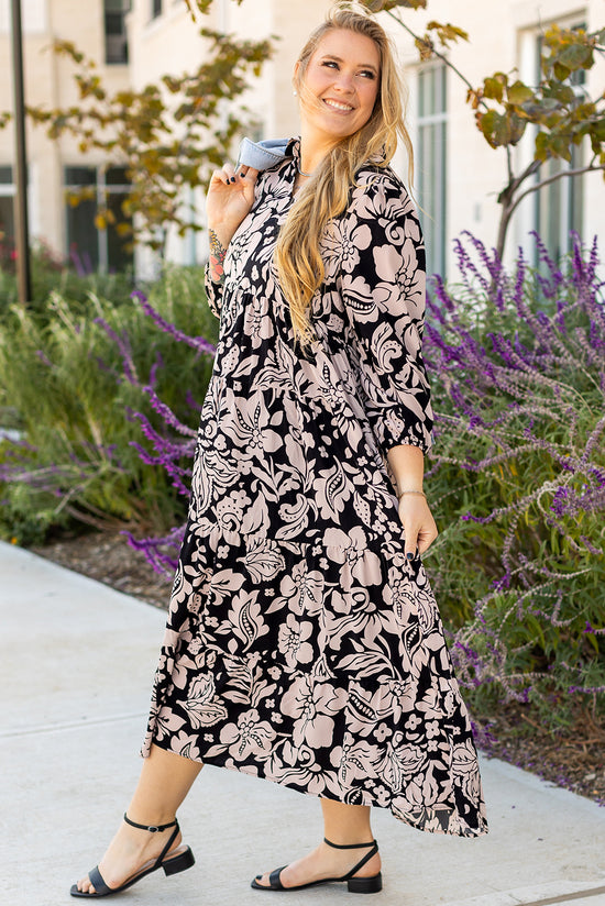 Long black dress with floral print and large puffing sleeves