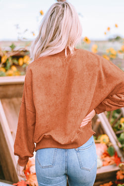 Orange sweatshirt with neck and drooping shoulders