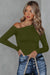 Green long sleeve knit top with asymmetrical neckline