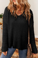 Black V-neck sweater with openwork crochet