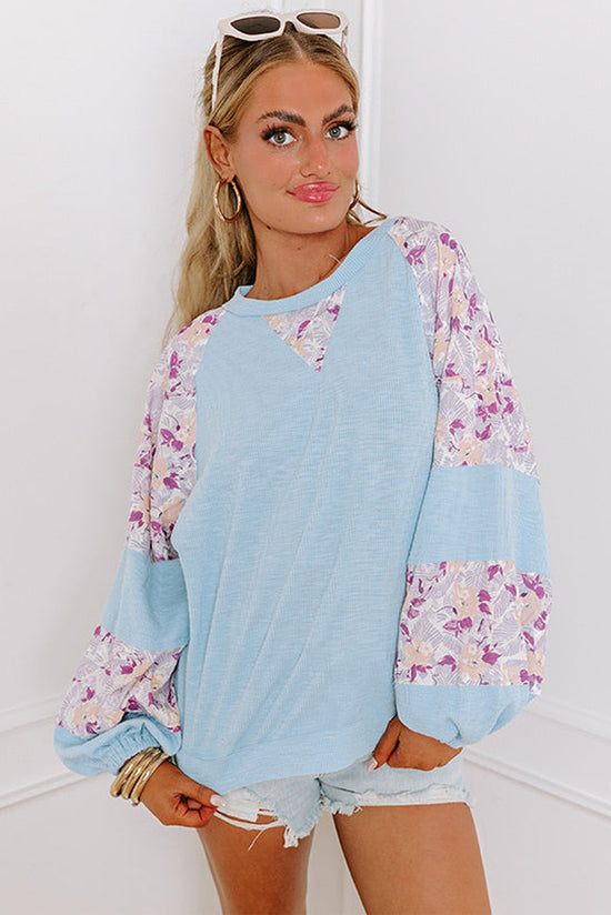 Beau Blue - Textured blouse with balloon sleeves and floral patchwork