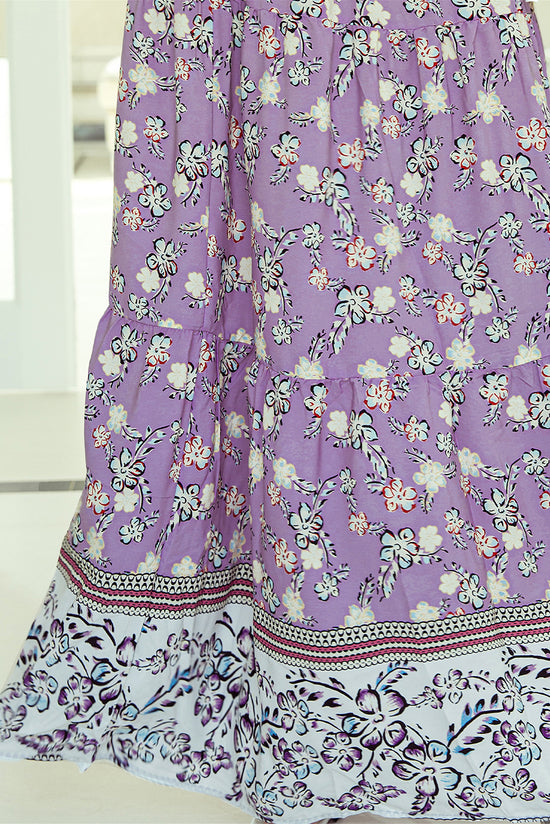 Long -sized long -waisted skirt with purple floral print