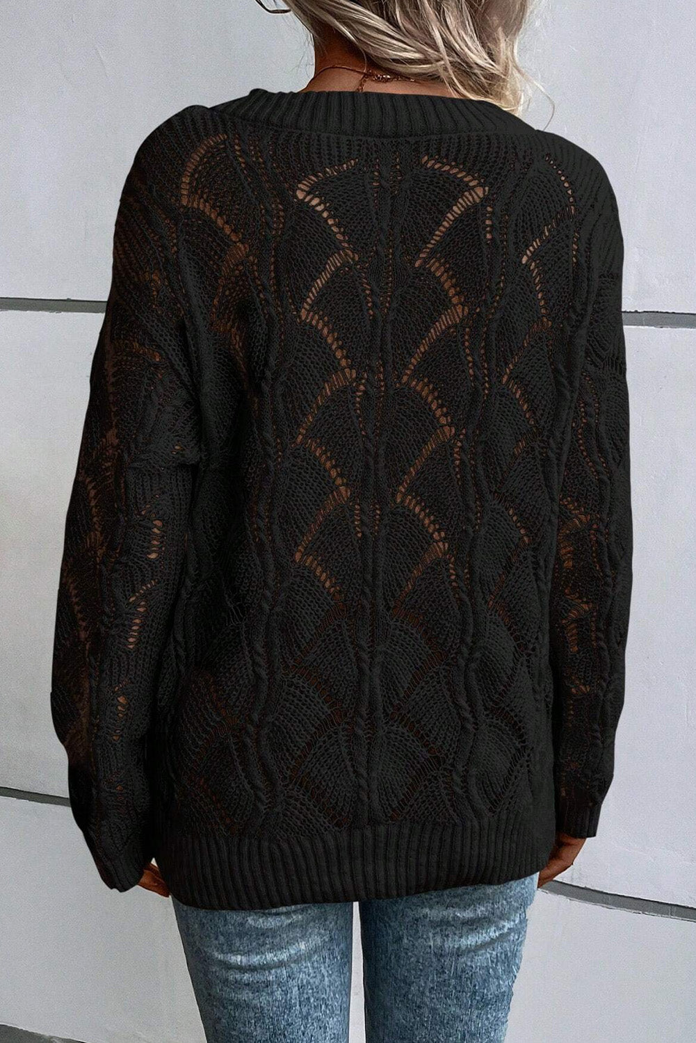 Black openwork knit sweater with V-neck and dropped shoulders