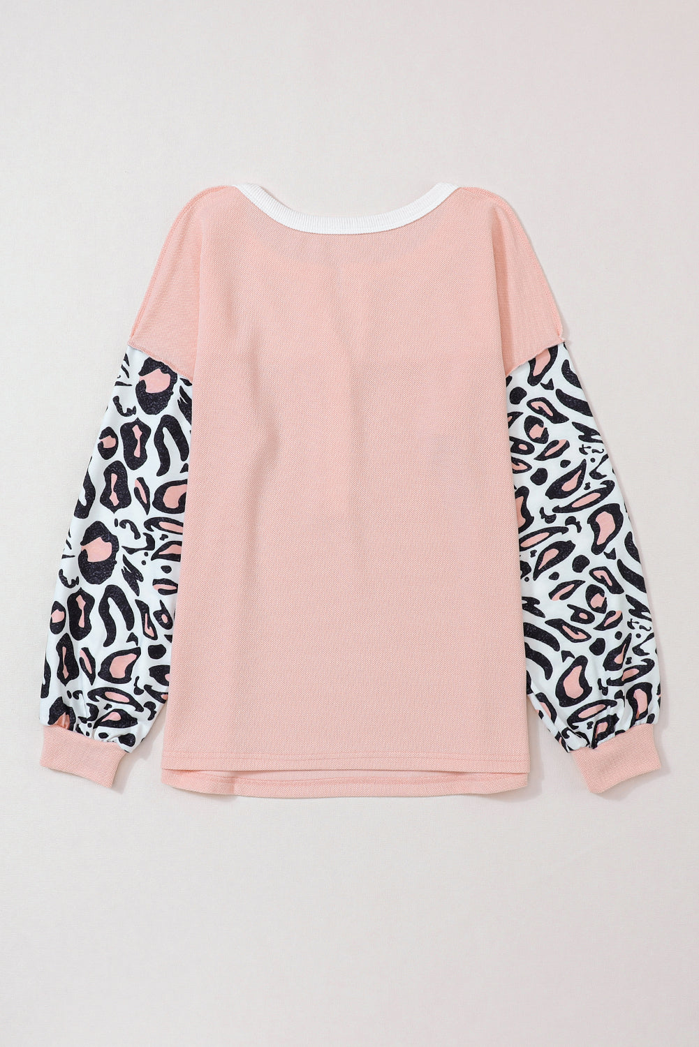 Top de punto tipo gofre con patchwork y mangas de leopardo rosa