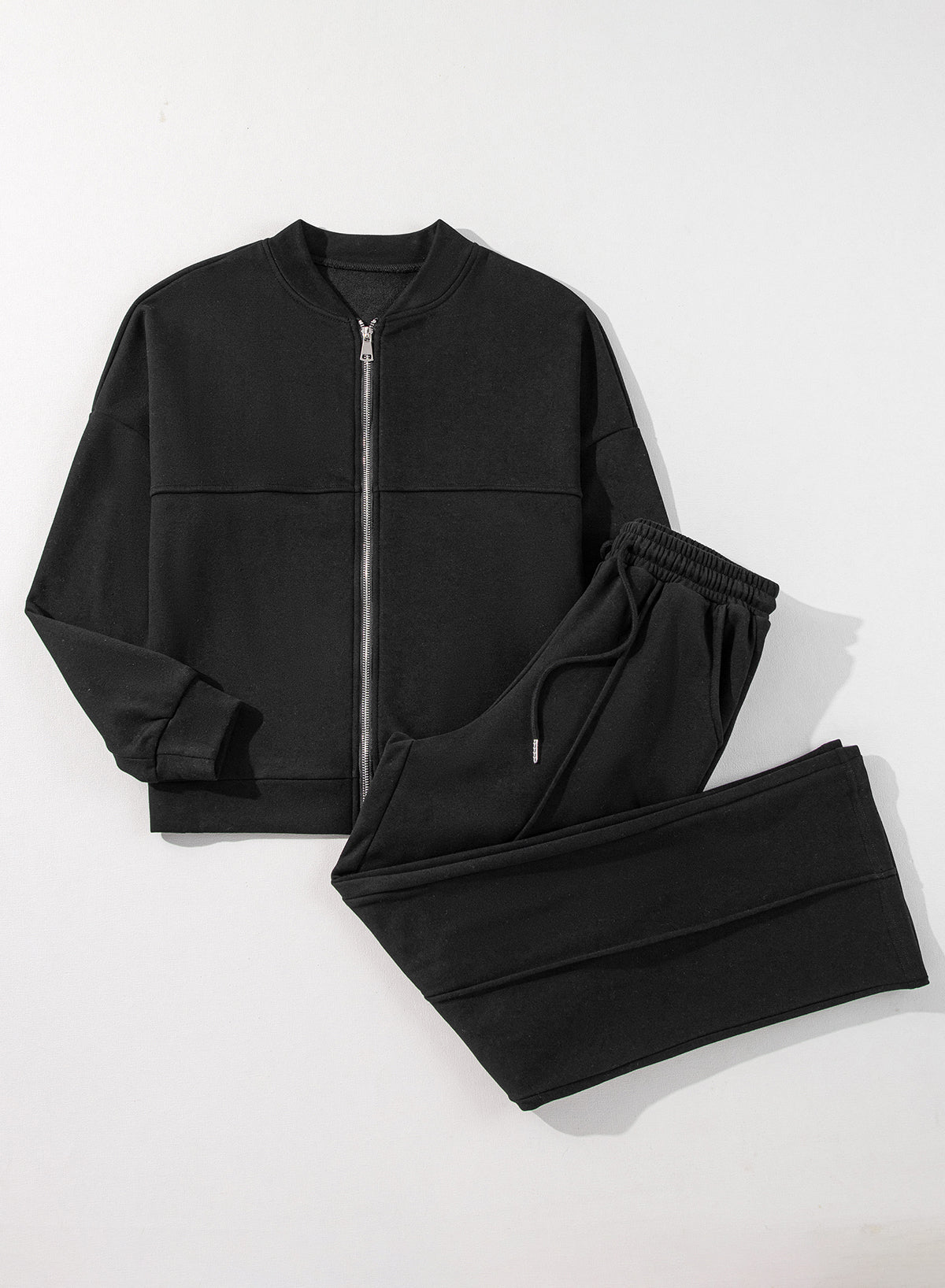 Black zip-up jacket with solid seams and drawstring waist pants set