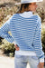 Sky blue striped sweater with zipped collar and dropped shoulders