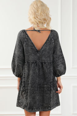 Black pleated denim babydoll dress with v-neck and puff sleeves