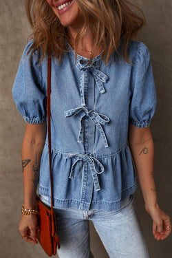 Twilight blue denim shirt tied on the front with bubble and basque sleeves