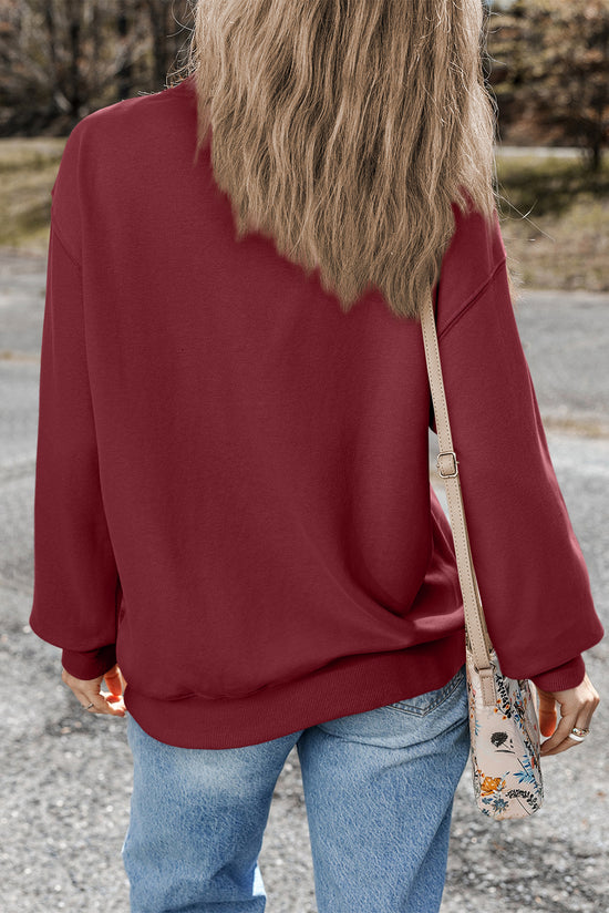 Solid burgundy sweatshirt with dropped shoulders and round neck