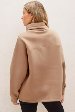 Light beige turtleneck sweatshirt with dolman sleeves and drawstring