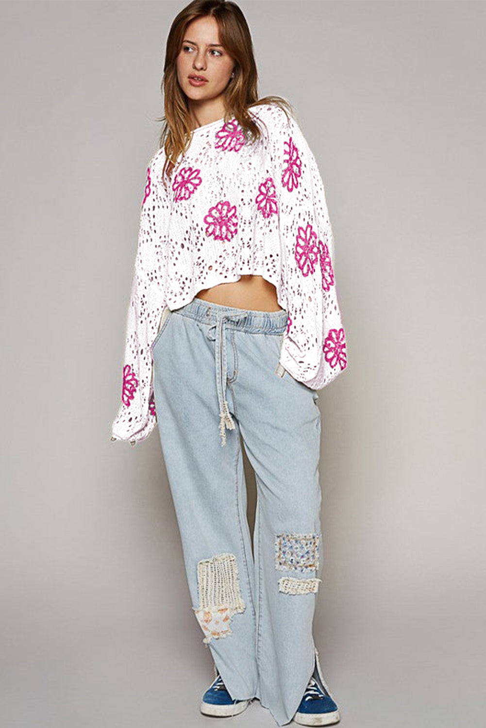 White drop shoulder sweater with contrast floral print eyelets