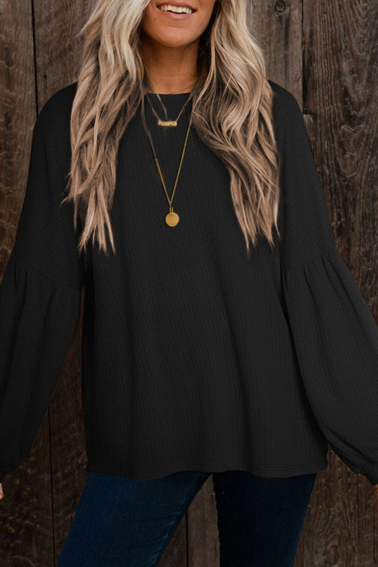 Black long puff sleeve top in faux knit jacquard