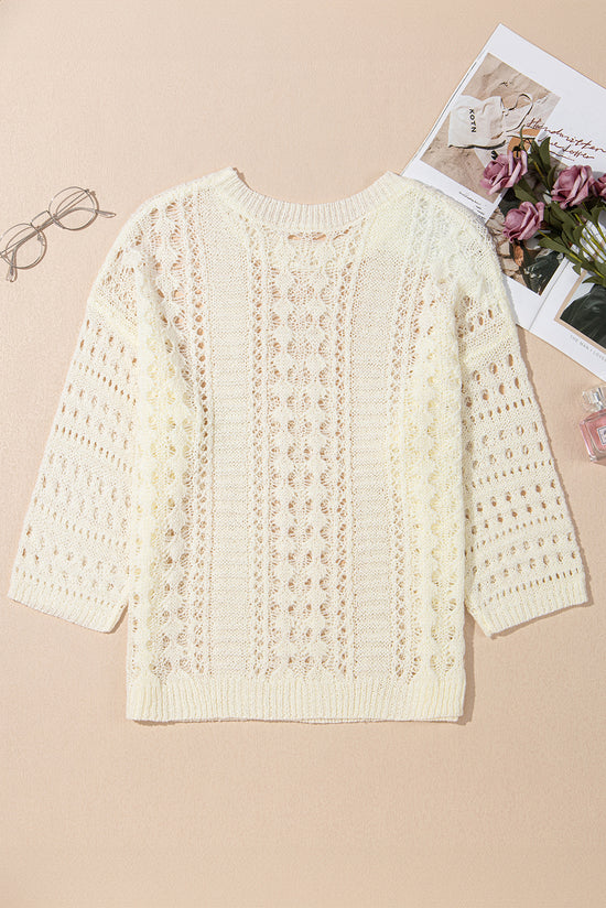 Pull blanc en tricot ajouré à manches bouffantes*