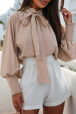 Khaki blouse with ruffles and flared sleeves with an upright and knotted collar