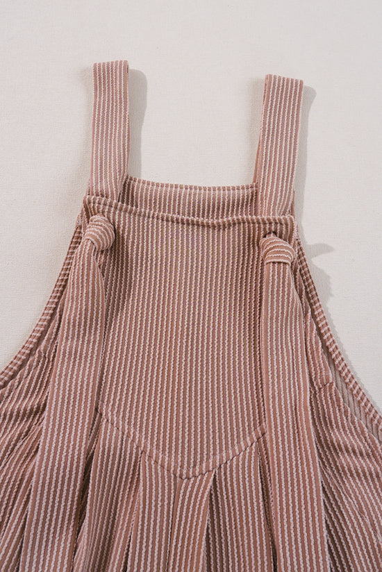 Ample overalls with adjustable straps and cord, wide leg