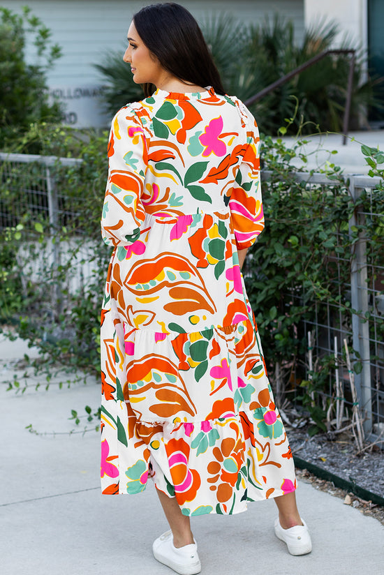 Vestido de naranja largo con un estampado floral dividido con cuello en V y varios niveles