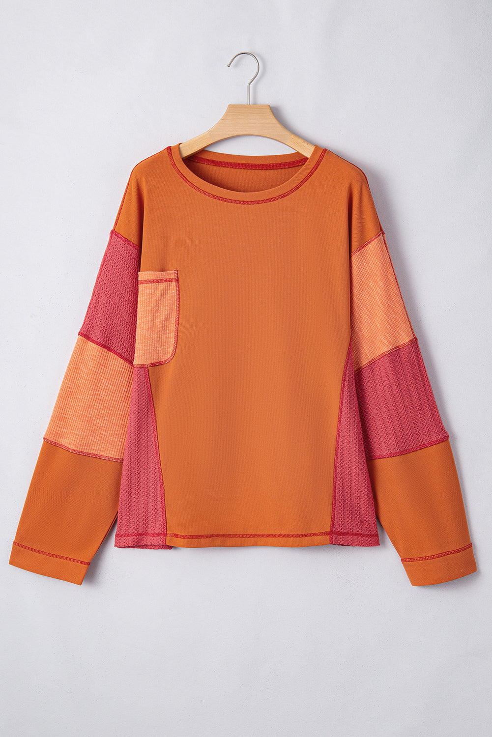 Haut orange en tricot texturé avec bloc de couleurs et poche poitrine en patchwork de grande taille