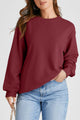 Solid burgundy sweatshirt with dropped shoulders and round neck