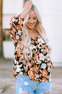 Brown babydoll blouse with floral print and 3/4 sleeves